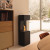 Planika Arcticon Black freestanding bioethanol fireplace with automatic control and sleek black finish.