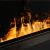 Cool Flame 1500 Pro Insert – a sleek black vapour fireplace with remote control and Opti-myst flame effect.