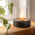 Planika Lotus tabletop bioethanol fireplace in black with a sleek, modern design, offering 3.5 hours of burn time and 2.5 kW hea