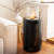 Planika Mandala bioethanol fireplace in black, a stylish floor-standing model with a 1.5L capacity and 3.5-hour burn time.