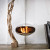 Cocoon Aeris Polished Steel ceiling-mounted bioethanol fireplace with a sleek steel pole, offering modern elegance and efficient