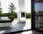 Safretti Cubico XL bioethanol fireplace in brushed stainless steel, a modern floor-standing heating solution.