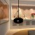 Cocoon Aeris Matte Black with Black Rod – a ceiling-mounted bioethanol fireplace with a sleek matte black finish and modern desi
