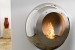 Cocoon Vellum Polished Steel wall-mounted bioethanol fireplace with a sleek and modern design.
