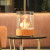 Dancing Flames Table Fireplace in cork finish, featuring a stylish design with a real flame effect and a manual control system.