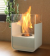 ScandiFlames white tabletop bioethanol fireplace made of steel, featuring a sleek and modern design.